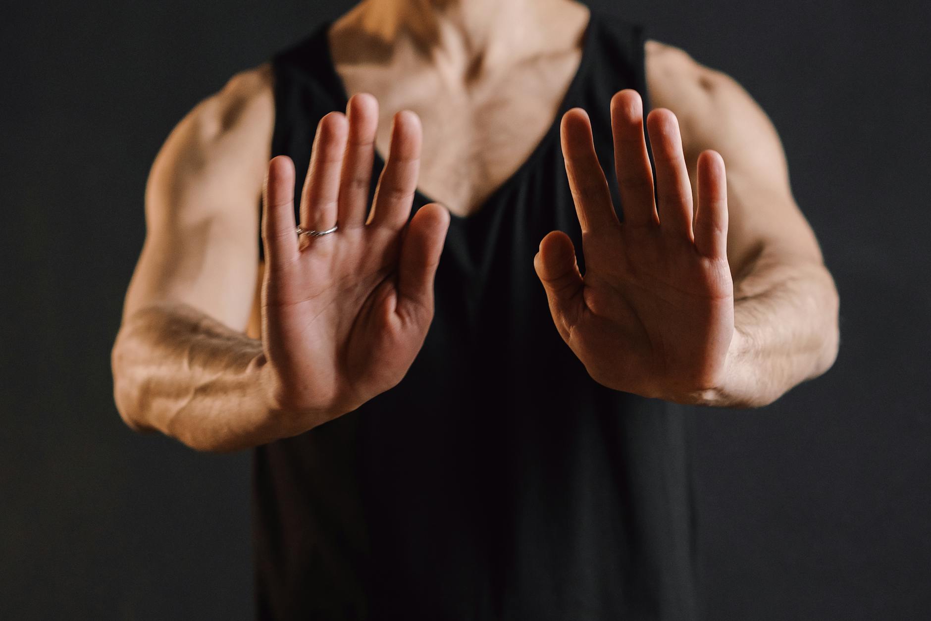 Person meditating with hands in gyan mudra pose, focused